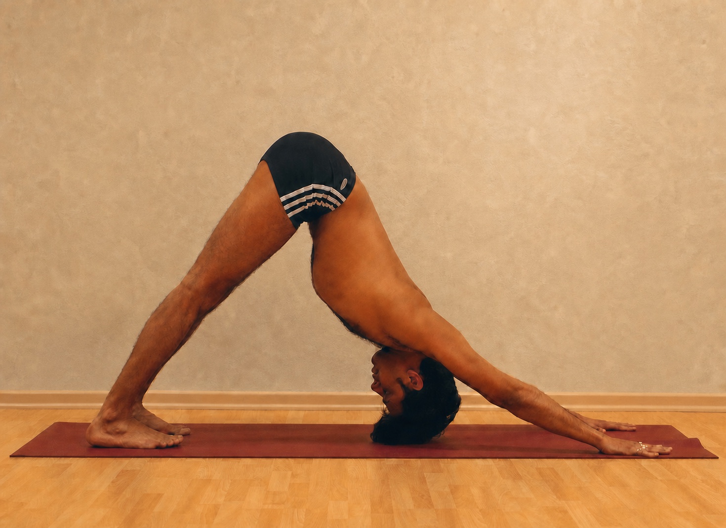 Adho Mukha Svanasana yoga practice demonstrated by Pankaj