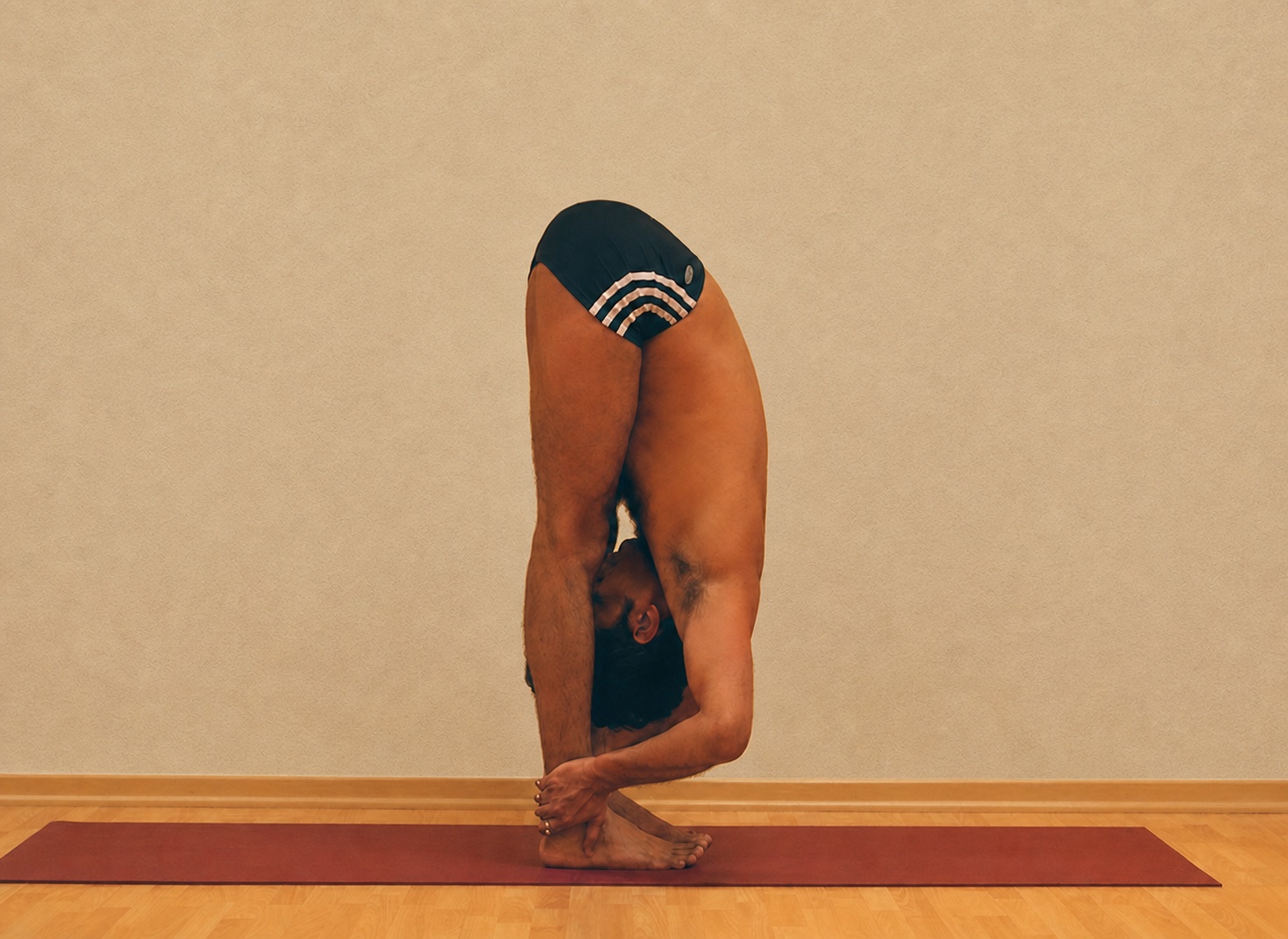 Uttanasana yoga practice demonstrated by Pankaj