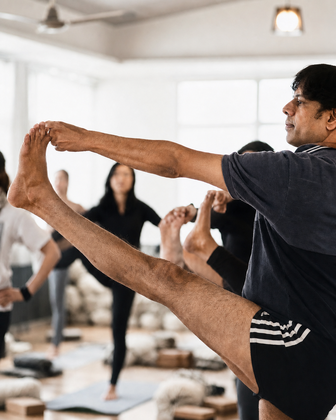 Yoga teacher Pankaj demonstrating focused asana practice